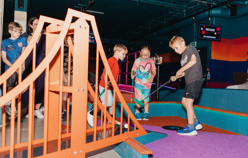 Win a free family pass at Mulligans digital crazy golf in Guildford